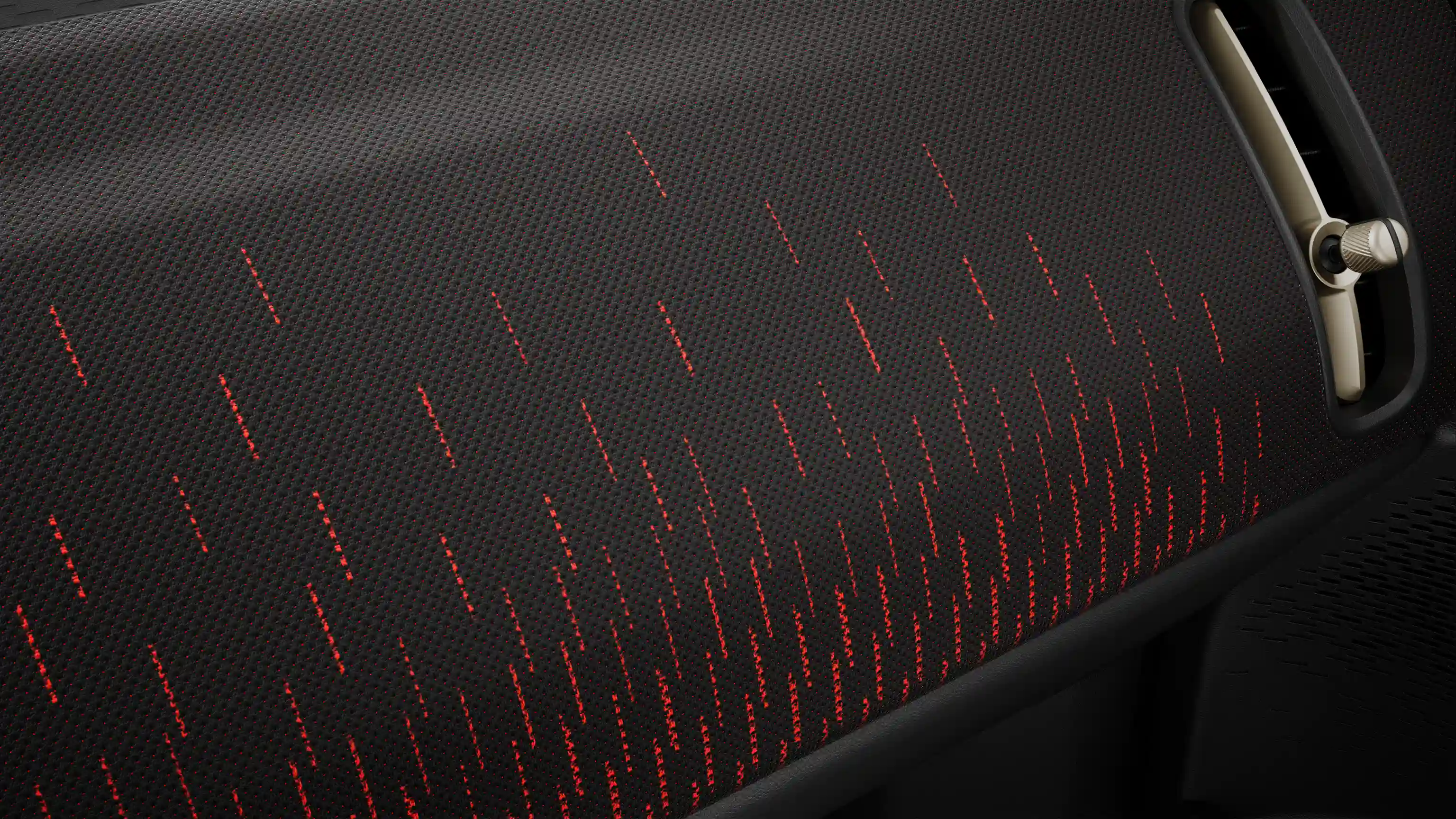 A tisztán elektromos MINI Countryman JCW Style piros és fekete színben tündöklő műszerfala