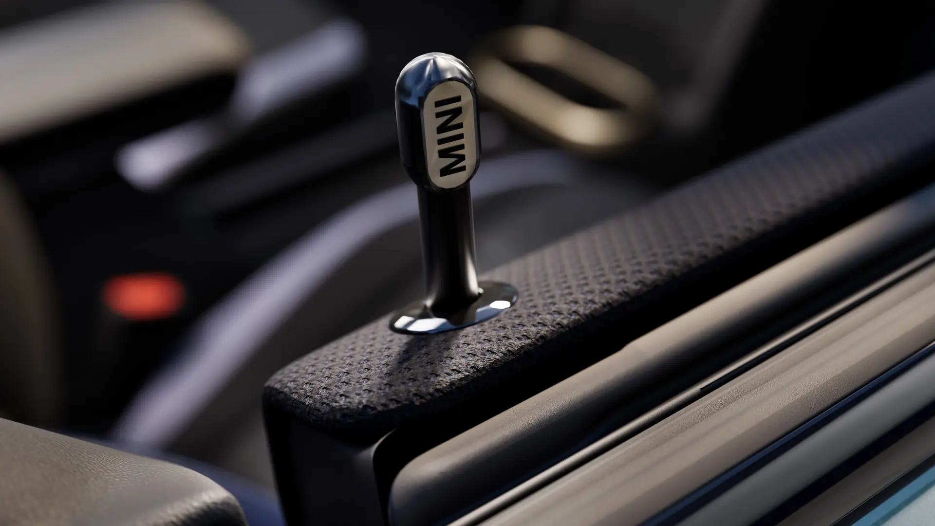 Az eredeti fekete eloxált alumínium MINI beltéri ajtózáró gomb közelképe.